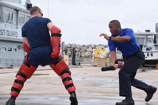 Steven Celestine, a member of the Commonwealth of Dominica Coast Guard, practices law enforcement techniques during Exercise Tradewinds 2017 at the Barbados Coast Guard Base in Bridgetown, Barbados, June 9, 2017. Tradewinds 2017 is a joint, combined exercise conducted in conjunction with partner nations to enhance the collective abilities of defense forces and constabularies to counter transnational organized crime, and to conduct humanitarian/disaster relief operations. (U.S. Coast Guard photo by Petty Officer 1st Class Melissa Leake/Released)