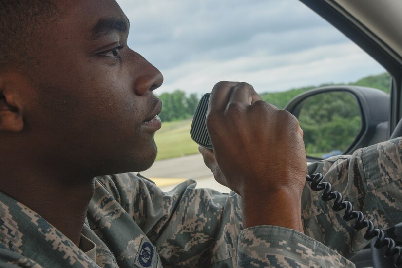 Airman 1st Class Isaiah Davis, 89th Operations Support Squadron airfield manager, communicates with air traffic control during a foreign object debris inspection on the flightline at Joint Base Andrews, Md., June 7, 2017. The flightline is busy with aircrafts and vehicles, therefore airfield management and air traffic control work together to prevent accidents. (U.S. Air Force photo by Airman 1st Class Valentina Lopez)