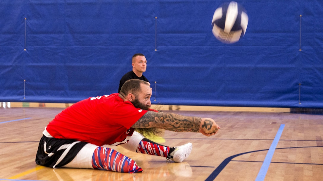Retired Navy Seaman Steven Davis practices sitting volleyball drills with other members of Team Navy during the Navy Wounded Warrior Walter Reed Adaptive Sports training camp in Bethesda, Md., June 10, 2017. Davis was an aviation electrician’s mate. The camp helped the athletes prepare for the 2017 Department of Defense Warrior Games, which begin June 30 in Chicago. Navy photo by Petty Officer 2nd Class Charlotte C. Oliver