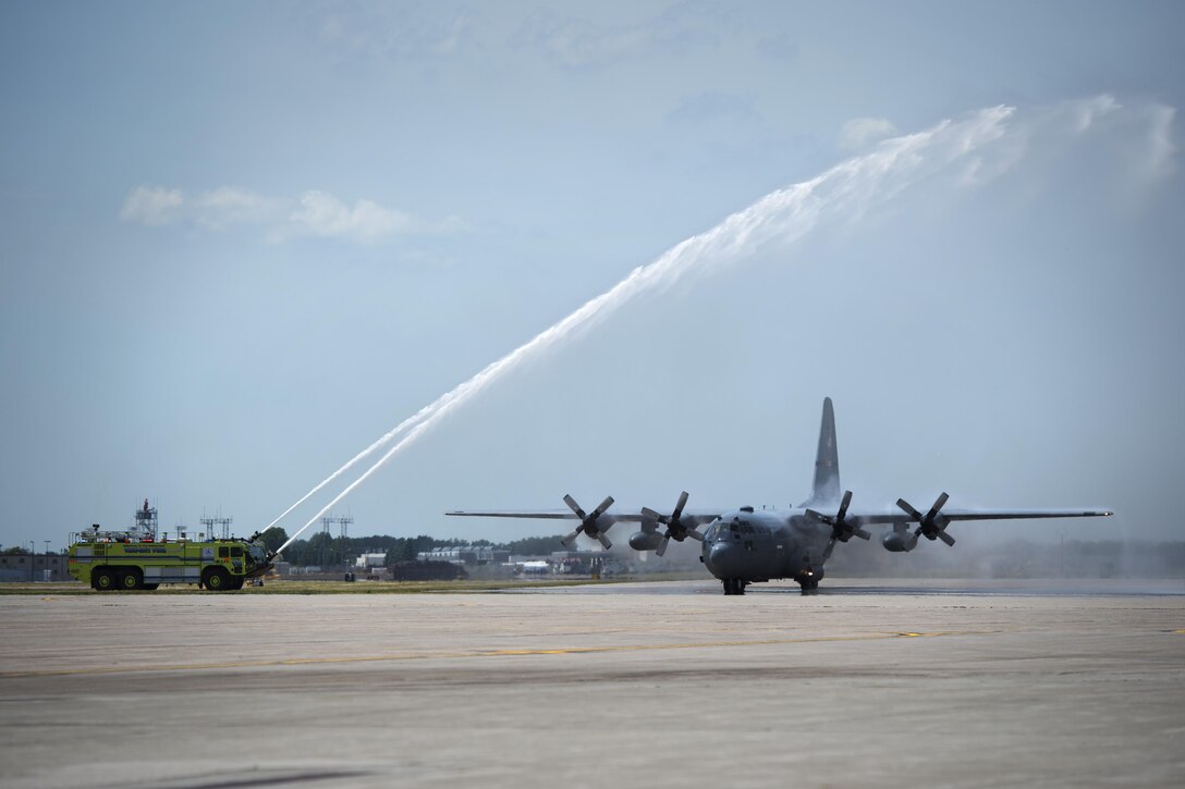 Minnesota Air National Guard's Assistant Adjutant General, Air, Brig. Gen. David Hamlar Jr. took his ceremonial final flight at the 133rd Airlift Wing in St. Paul, Minn., June 9, 2017. Hamlar received the traditional "all washed up" treatment upon touching the ground from awaiting crew, family and friends. (U.S. Air National Guard photo by Tech. Sgt. Austen R. Adriaens/Released)