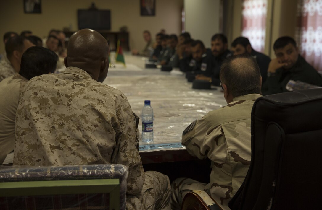 Col. David Gibbs, left, commanding officer of team police, Task Force Southwest, and Col. Abrahiem Asim, right, the chief of staff of the 505th Zone Afghan National Police, speak during a meeting at Bost Airfield, Afghanistan, May 13, 2017. The meeting consisted of advisors from Task Force Southwest and sub-district police chiefs out of Lashkar Gah. They discussed the security of Lashkar Gah and what improvements should be made to ensure the safety of the local population. Task Force Southwest, comprised of approximately 300 Marines and Sailors from II Marine Expeditionary Force, are training, advising and assisting the Afghan National Army 215th Corps and the 505th Zone National Police. (U.S. Marine Corps photo by Sgt. Justin T. Updegraff)