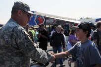 A young boy thanks Maj. Gen. Troy D. Kok for his service June 10 during “Army Day At The Races” at Old Bridge Township Raceway Park in Englishtown, New Jersey.  Kok, commanding general of the U.S. Army Reserve’s 99th Regional Support Command, headquartered at Joint Base McGuire-Dix-Lakehusrt, New Jersey, was at the event to help celebrate the Army’s 242nd birthday during the National Hot Rod Association’s Summernationals.