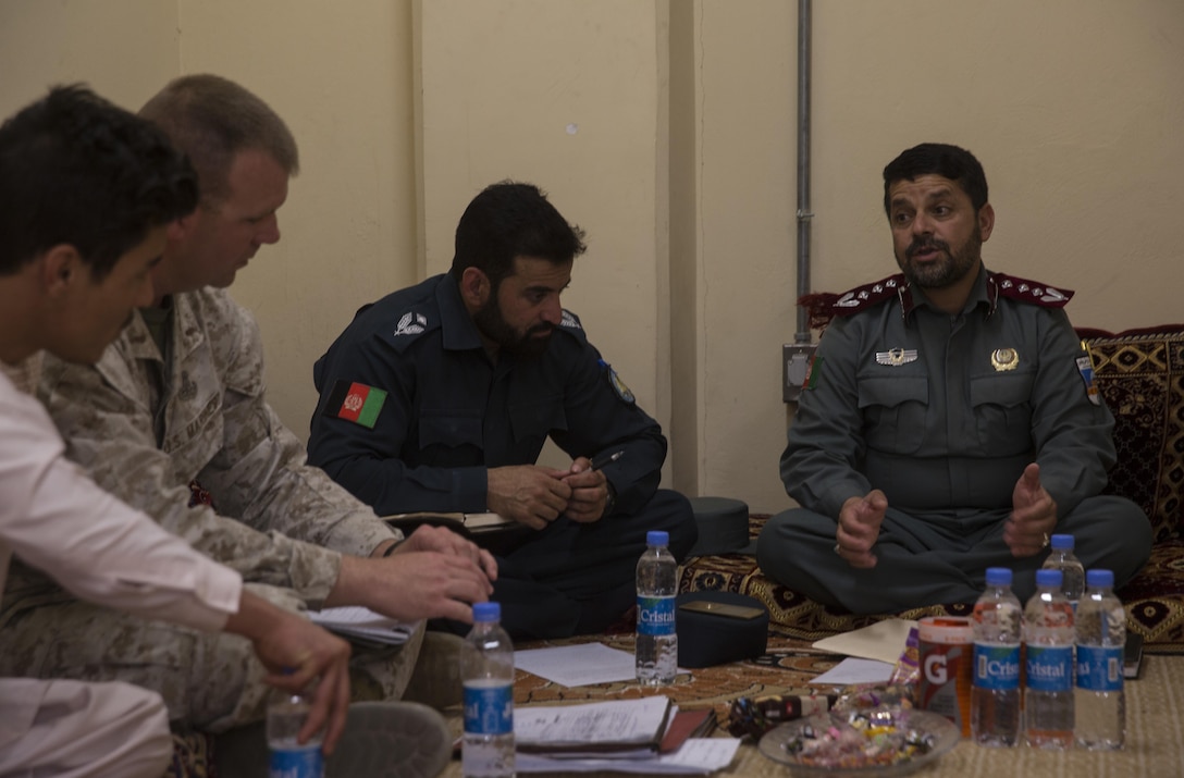 A U.S. Marine advisor with Task Force Southwest receives feedback from his Afghan National Police counterpart at Bost Airfield, Afghanistan, May 15, 2017, where they discussed classes that the advisors will teach over the next few weeks. The classes will consist of the various explosive ordnance disposal techniques as well as how to properly use their EOD robot and vallon metal detectors. Task Force Southwest, comprised of approximately 300 Marines and Sailors from II Marine Expeditionary Force, are training, advising and assisting the Afghan National Army 215th Corps and the 505th Zone National Police. (U.S. Marine Corps photo by Sgt. Justin T. Updegraff)