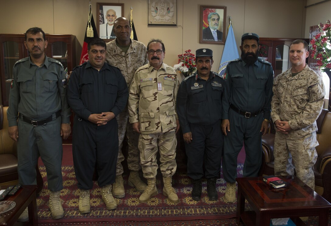Col. Abrahiem Asim, center, the chief of staff of the 505th Zone Afghan National Police, Marine advisors with Task Force Southwest and the District Chief of Police pose for a picture at the conclusion of their meeting at Bost Airfield, Afghanistan, May 17, 2017. The district chief of police from each district met to ensure is the districts are working together and that the supply needs are met at the security checkpoints.  Task Force Southwest, comprised of approximately 300 Marines and Sailors from II Marine Expeditionary Force, are training, advising and assisting the Afghan National Army 215th Corps and the 505th Zone National Police. (U.S. Marine Corps photo by Sgt. Justin T. Updegraff)