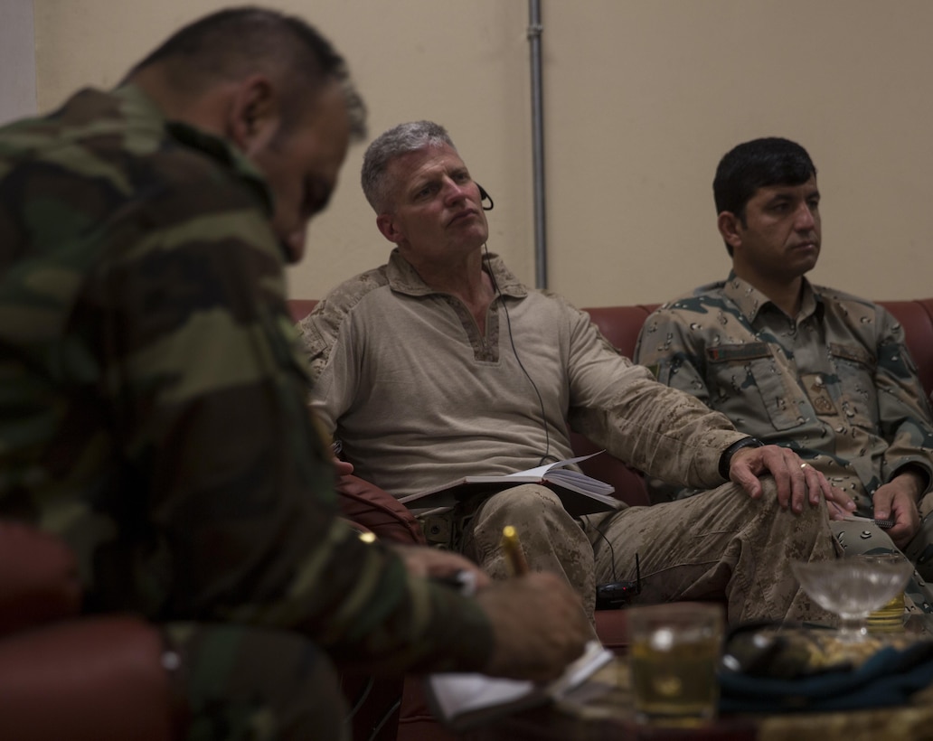 Brig. Gen. Roger Turner, center, commanding general of Task Force Southwest, listens during a security meeting at Bost Airfield, Afghanistan, May 20, 2017. Gen. Turner, and the key leaders, discussed defensive and offensive operations in the area. Task Force Southwest, comprised of approximately 300 Marines and Sailors from II Marine Expeditionary Force, are training, advising and assisting the Afghan National Army 215th Corps and the 505th Zone National Police. (U.S. Marine Corps photo by Sgt. Justin T. Updegraff)