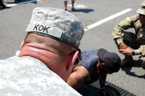 Maj. Gen. Troy D. Kok, commanding general of the U.S. Army Reserve’s 99th Regional Support Command, headquartered at Joint Base McGuire-Dix-Lakehusrt, New Jersey, counts push-ups June 10 at the GoArmy experience during “Army Day At The Races” at Old Bridge Township Raceway Park in Englishtown, New Jersey.  Kok was at the event to help celebrate the Army’s 242nd birthday during the National Hot Rod Association’s Summernationals.