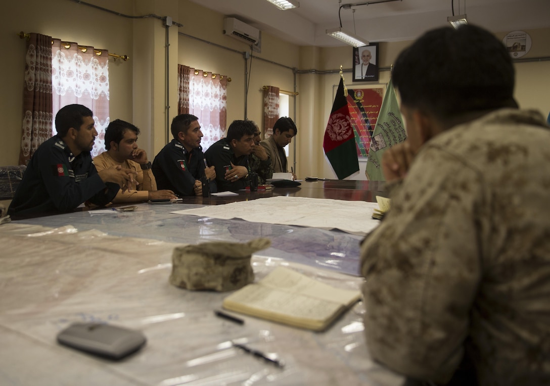 A U.S. Marine advisor, right, with Task Force Southwest, listens to his counterparts during an information operations meeting at Bost Airfield, Afghanistan, May 20, 2017. Task Force Southwest, comprised of approximately 300 Marines and Sailors from II Marine Expeditionary Force, are training, advising and assisting the Afghan National Army 215th Corps and the 505th Zone National Police. (U.S. Marine Corps photo by Sgt. Justin T. Updegraff)