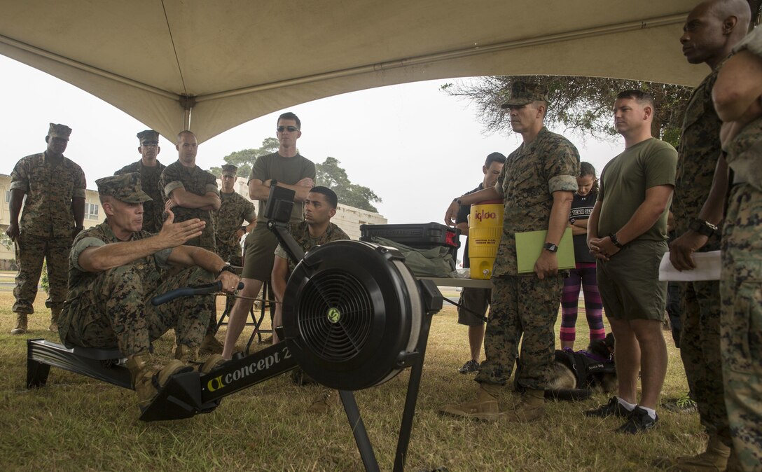 Lt. Col. Paul Melchior, the Force Fitness division action officer, demonstrates the proper form when using the rowing machine at the Force Fitness Instructor Promotion Tour on Marine Corps Base Hawaii June 8, 2017. The rowing machine will supplement the 3-mile run portion of the Physical Fitness Test for Marines on light or limited duty, as well as presenting an option for Marines older than 46. (Photo by Lance Cpl. Luke Kuennen)