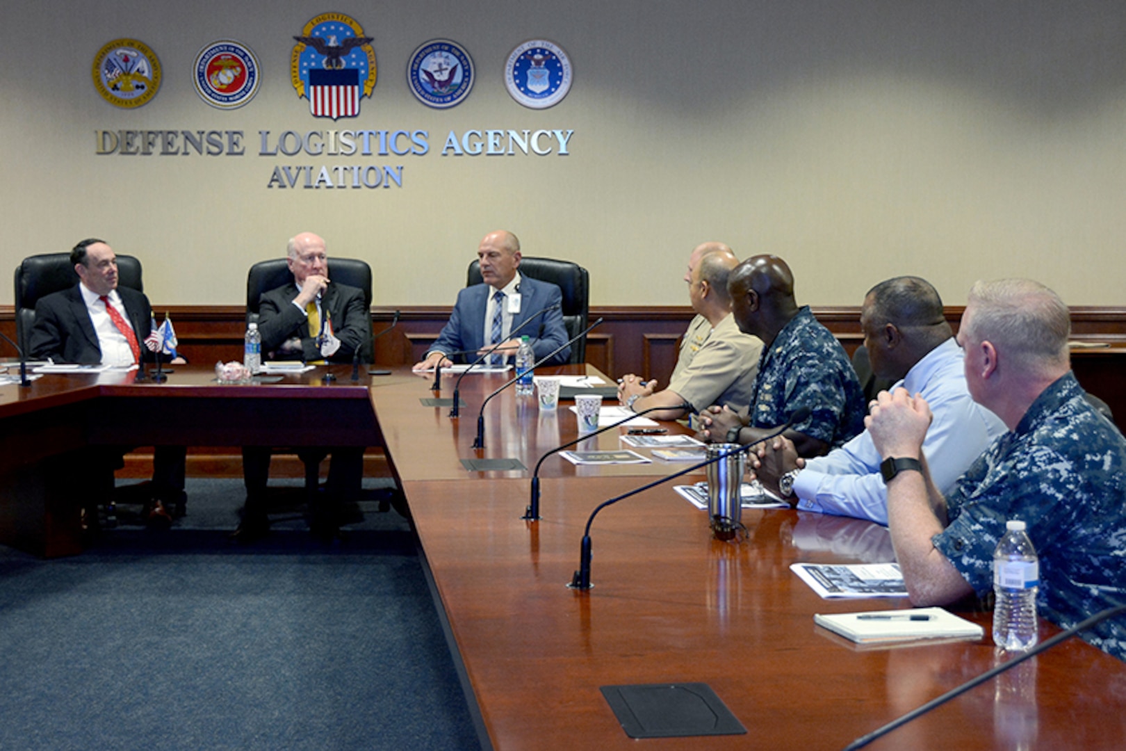 Graybeards, retired Rear Adm. Michael Finley and retired Vice Adm. Michael Malone (from left to right), receive a brief on Defense Logistics Agency Aviation’s logistical support of the Boeing F/A-18E and F/A-18F Super Hornet by DLA Aviation Deputy Commander Charlie Lilli, Chief of Staff at DLA Aviation Steve Kinskie, along with Navy Cmdr. Eric Lockett, Operations Officer, Navy Customer Facing Division, Customer Operations Directorate, DLA Aviation and Navy Capt. Mark Harris, Chief, Navy Customer Facing Division, Customer Operations Directorate, DLA Aviation June 6, 2017 at Defense Supply Center Richmond, Virginia.  