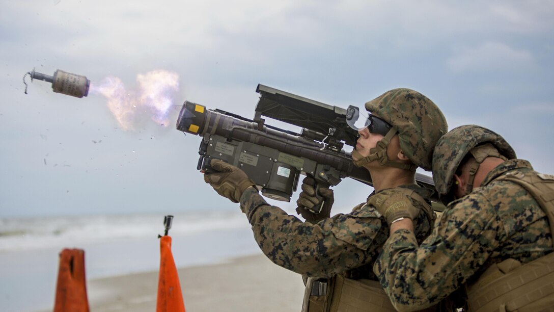 Marine Corps Lance Cpl. Nicholas A. Conti, left, and Cpl. Mark L. Albridge fire an FIM-92 Stinger missle during a live-fire training exercise at Camp Lejeune, N.C., June 6, 2017. Both are low-altitude air defense gunners. Marine Corps photo by Lance Cpl. Cody J. Ohira