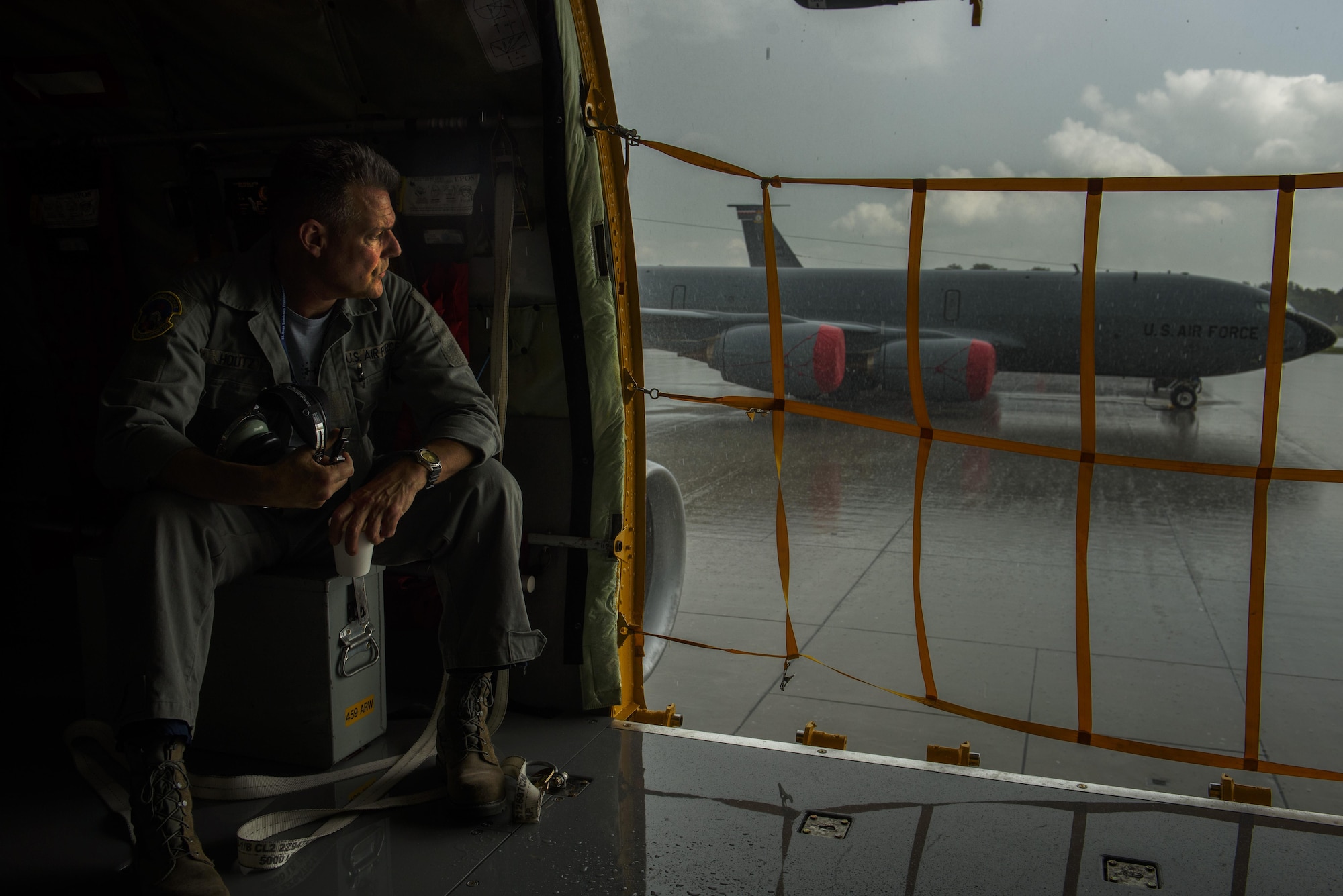 Master Sgt. John Houtz, 459th Aircraft Maintenance Squadron flightline hydraulics, is part of the Total Force Citizen Airmen team waits until the rain stops on a KC-135R Stratotanker during BALTOPS exercise at Powidz Air Base,
Poland, June 12, 2017. The exercise is designed to enhance flexibility and interoperability, to strengthen combined response capabilities, as well as demonstrate resolve among Allied and Partner Nations' forces to ensure stability in, and if necessary defend, the Baltic Sea region. (U.S. Air Force photo by Staff Sgt. Jonathan Snyder)