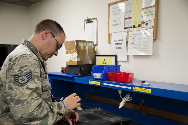 U.S. Air Force Staff Sgt. Scott Phillips, the NCO in charge of maintenance and data collection assigned to the 6th Operation Support Squadron maintains radio equipment used to communicate with pilots at MacDill Air Force Base Fla., April 27, 2017. The equipment is used to help pilots communicate where and how best to land their aircraft. (U.S. Air Force Photo by Airman 1st Class Rito Smith) 