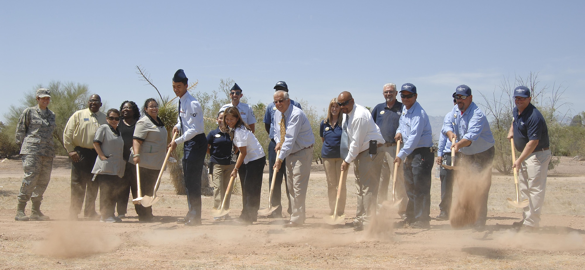 Daniel Baker, the 355th Force Support Squadron lodging general manager, and Davis-Monthan Air Force Base’s lodging team perform a ceremonial ground breaking for the Inn at Davis-Monthan Air Force Base, Ariz., June 9, 2017. Construction of the new lodging facilities are scheduled to be completed between January and February of 2019. (U.S. Air Force photo by Airman 1st Class Frankie Moore)