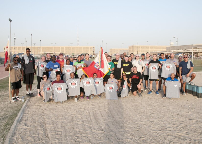 Soldiers of the 369th Sustainment Brigade, 369th Special Troops Battalion, and HHC 369th pose for a photo following the inaugural Harlem Hellfighter 5K run, held at Camp Arifjan, Kuwait on June 2, 2017. The event was held to celebrate the 104th anniversary of the formation of the historic New York National Guard unit. The unit was given their historic nickname “Hellfighters” by their German opponents in WWI for their remarkable prowess on the battlefield. (U.S. Army photo by Sgt. Jeremy Bratt)