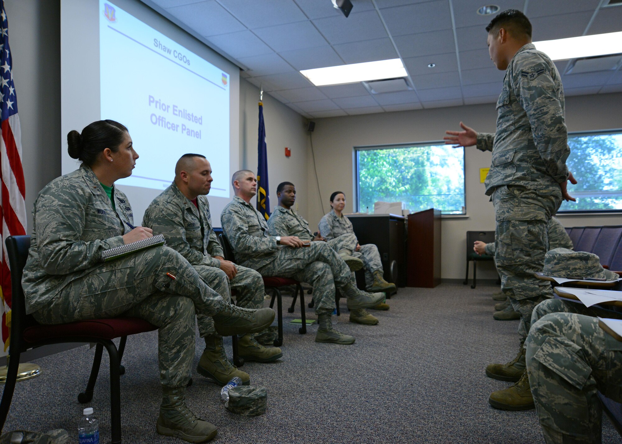 U.S. Air Force Airman 1st Class Daniel Aguda, 20th Civil Engineer Squadron water and fuels system maintenance apprentice, asks panel members a question during a company grade officer mentorship panel at Shaw Air Force Base, S.C., April 28, 2017. The panel answered questions from attendees about applying for the Scholarship for Outstanding Airman, Officer Training School, the Air Force Academy and the Airman Scholarship Commissioning Program. (U.S. Air Force photo by Airman 1st Class Kathryn R.C. Reaves)