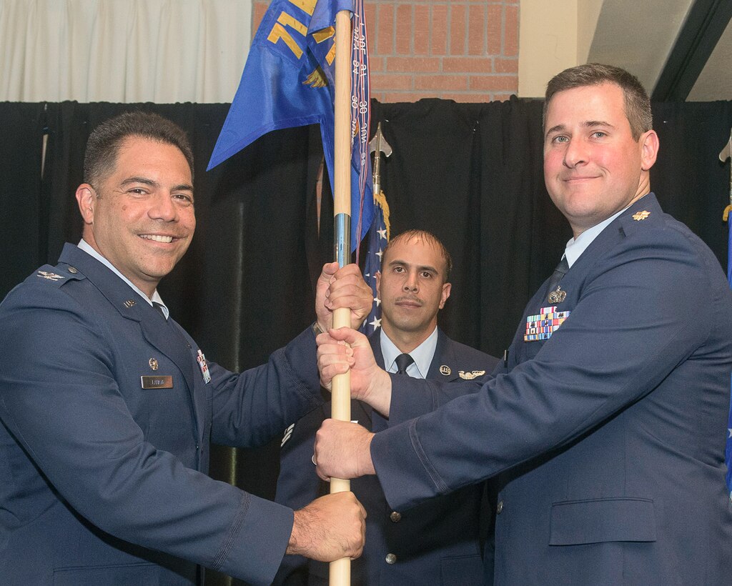 Maj. Keith Carson, right, accepts the 71st Installation Support Squadron guidon, and command of the unit, from Col. Dwayne LaHaye, 71st Mission Support Group commander, during a change-of-command ceremony June 8 at Vance Air Force Base, Oklahoma. (U.S. Air Force photo/ Terry Wasson)