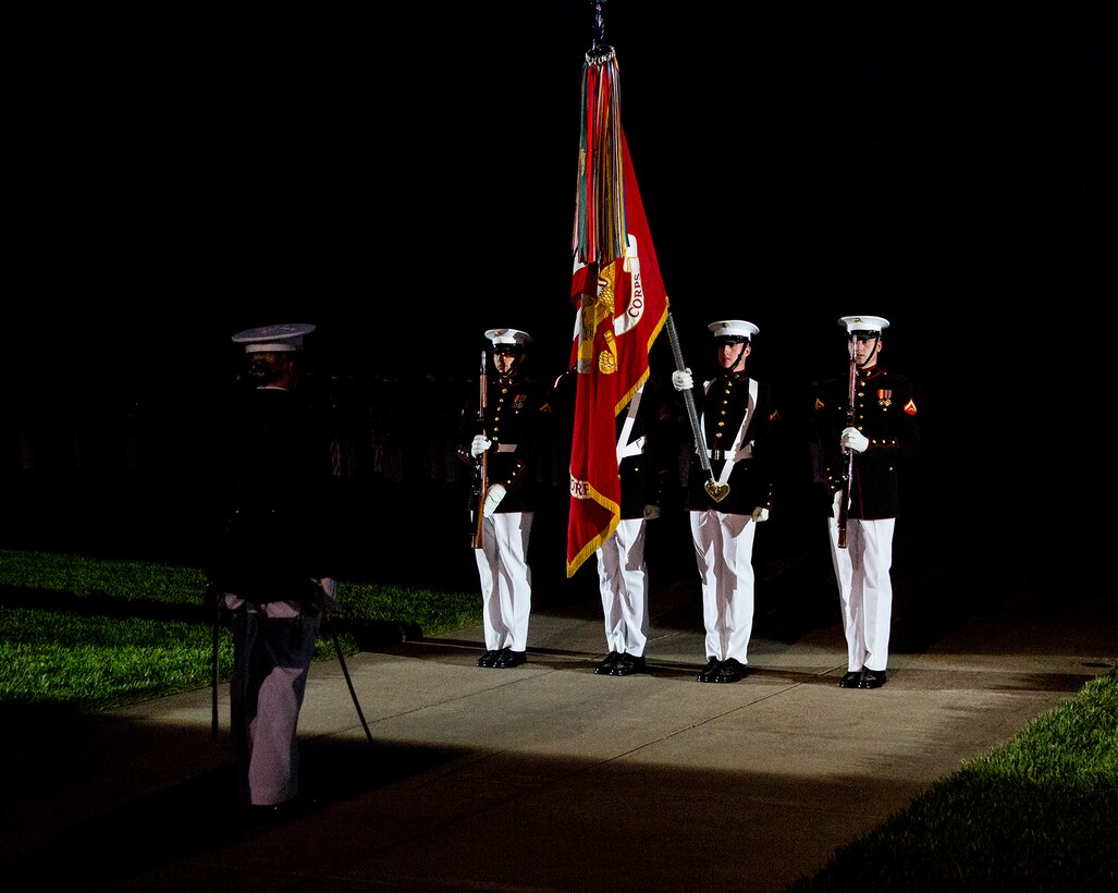 Members of the U.S. Marine Corps Color Guard render honors for the playing of the National Anthem during a Friday Evening Parade at Marine Barracks Washington D.C., July 9, 2017. The guest of honor for the parade was the Acting Secretary of the Navy, the Honorable Sean J. Stackley, and the hosting official was the Commandant of the Marine Corps, Gen. Robert B. Neller. (Official Marine Corps photo by Cpl. Robert Knapp/Released)
