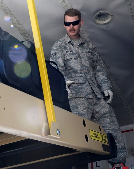 Senior Airman Jeremiah Kincaid, a vehicle management journeyman assigned to the 28th Logistics Readiness Squadron, loads luggage inside of an aircraft departing for Royal Air Force Fairford, United Kingdom June 3, 2017. Approximately 100 Airmen from Ellsworth Air Force Base, S.D. departed in support of multiple joint, multinational exercises. (U.S. Air Force photo by Senior Airman Denise M. Jenson)