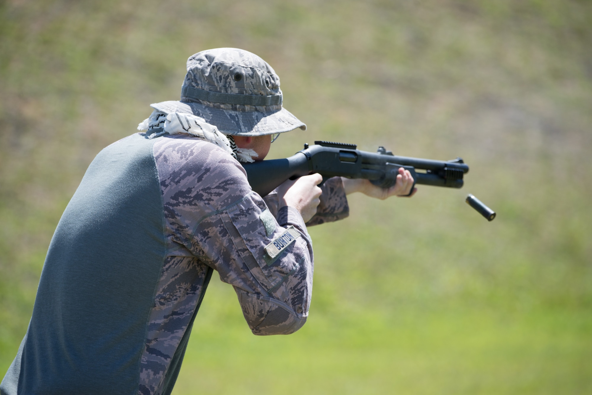 U.S. Air Force Senior Airman Caleb Bunton, 736th Security Forces fire team leader, fires an M870 shotgun April 29, 2017, at Naval Computer and Telecommunications Station, Guam. The 736th SFS won the four-stage team relay of the friendly shooting competition hosted by members of the Guam Police Department. (U.S. Air Force photo by Airman 1st Class Jacob Skovo)