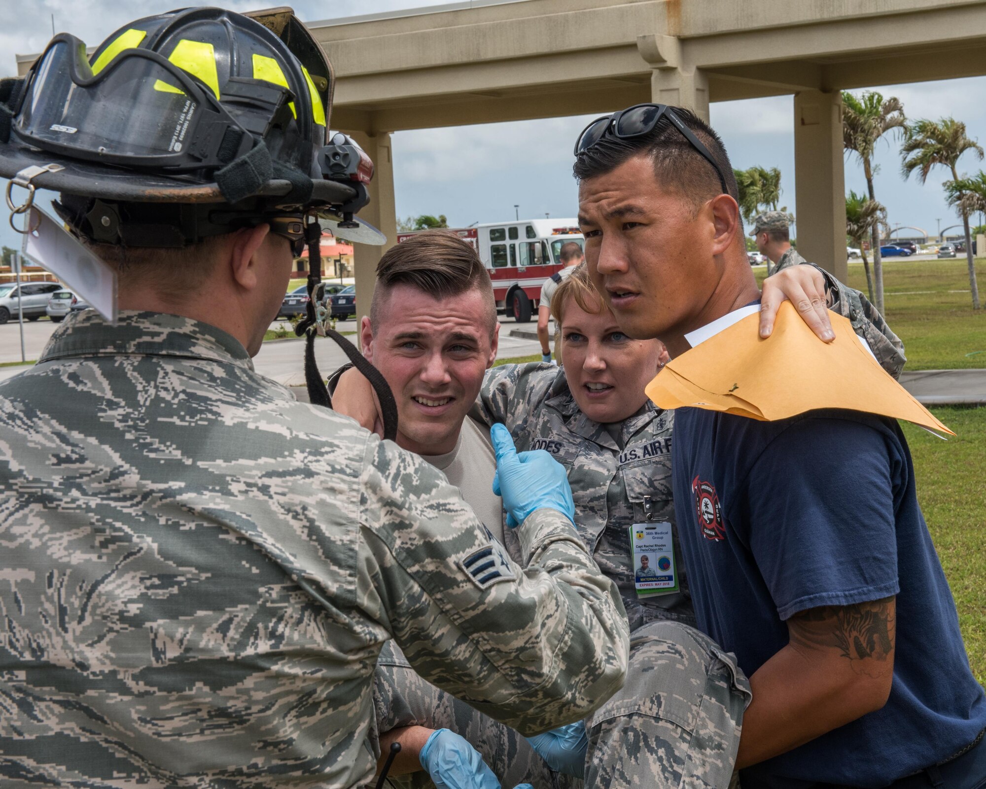 Emergency responders carry an Airman with a simulated injury to receive treatment during an emergency management exercise May 11, 2017, at Andersen Air Force Base, Guam. The exercise tested capabilities of emergency responders and support agencies. (U.S. Air Force photo by Airman 1st Class Jacob Skovo)