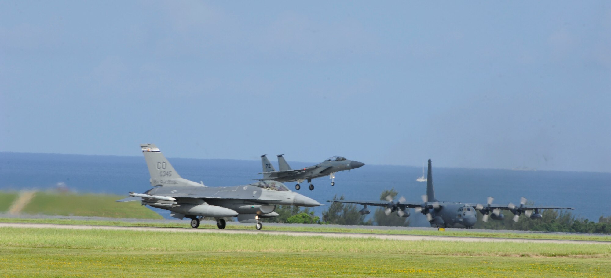 A U.S. Air Force F-16 Fighting Falcon assigned to the 120th Fighter Squadron, Buckley Air Force Base, F-15 Eagle assigned to the 44th FS, and an MC-130H Combat Talon II assigned to the 1st Special Operations Squadron conduct operations on the flightline June 7, 2017, at Kadena Air Base, Japan. The variety of aircraft stationed on and temporarily assigned to Kadena assist with maintaining Kadena’s premier air presence in the Pacific region. (U.S. Air Force photo by Senior Airman Lynette M. Rolen)
