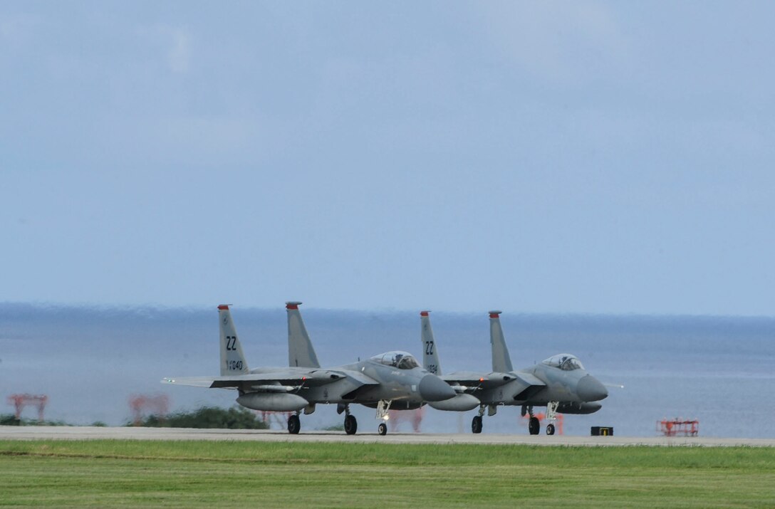 U.S. Air Force F-15 Eagles assigned to the 67th Fighter Squadron prepare to take off down the runway June 7, 2017, at Kadena Air Base, Japan. The F-15 is a classic all-weather, highly maneuverable war-fighting jet capable of being equipped with a variety of air-to-air weaponry. (U.S. Air Force photo by Senior Airman Lynette M. Rolen)