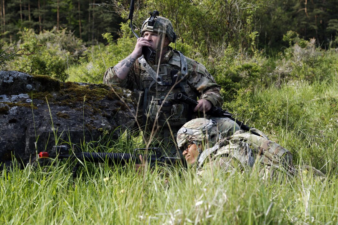 Soldier assigned to 1st Battalion, 501st Aviation Regiment, transmits information via field radio during Exercise Combined Resolve VIII, at Hohenfels Training Area, Germany, June 8, 2017 (U.S. Army/Michael Bradley)