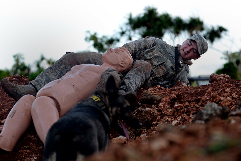 U.S. Air Force Staff Sgt. Tyler Cooper, 354th Security Forces Squadron, Eielson Air Force Base, Alaska, pulls a simulated casualty over a hill during the second annual Security Forces Advanced Combat Skills Assessment June 7, 2017 at Andersen Air Force Base, Guam. Over 100 Airmen and Soldiers throughout U.S. Pacific Command’s area of responsibility gathered to compete in the weeklong challenge. Service members were assessed in five different categories: weapons, tactics, combat fitness, mental and physical challenge, and military working dog handling. (U.S. Air Force photo by Airman 1st Class Gerald R. Willis)
