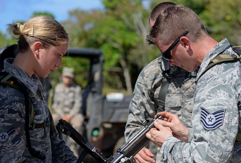 U.S. Airmen with the 35th Security Forces Squadron, Misawa Air Base, Japan, assemble an M240 machine gun during the second annual Security Forces Combat Skills Assessment June 6, 2017 at Andersen Air Force Base, Guam. The mental and physical challenge portion tested basic combat skills and knowledge of competitors at different stations along an obstacle course through the jungle. (U.S. Air Force photo by Airman 1st Class Gerald R. Willis)
