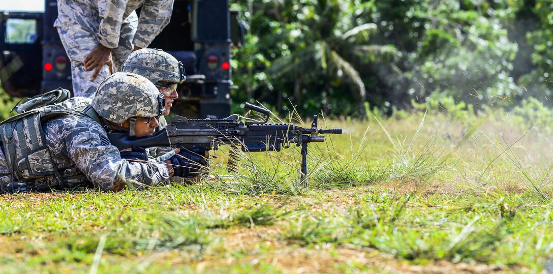 A U.S Airman fires an M249 light machine gun during the second annual Security Forces Advanced Combat Skills Assessment June 7, 2017, at Andersen Air Force Base, Guam. Over 100 Airmen and Soldiers throughout U.S. Pacific Command’s area of responsibility gathered to compete in five different categories: weapons, tactics, combat fitness, mental and physical challenge, and military working dog handling. (U.S. Air Force photo by Airman 1st Class Christopher Quail)
