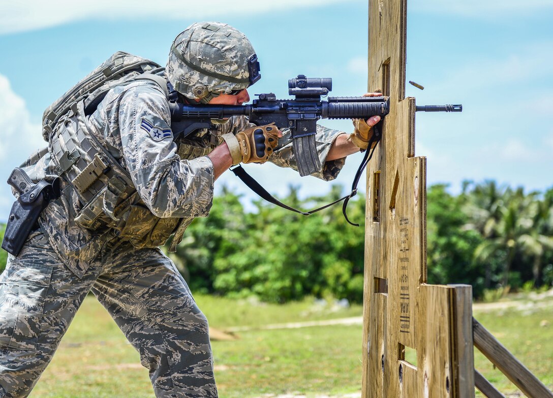 A U.S Airman fires a M4 carbine rifle during the second annual Security Forces Advanced Combat Skills Assessment June 7, 2017, at Andersen Air Force Base, Guam. Over 100 Airmen and Soldiers throughout U.S. Pacific Command’s area of responsibility gathered to compete in five different categories: weapons, tactics, combat fitness, mental and physical challenge, and military working dog handling. (U.S. Air Force photo by Airman 1st Class Christopher Quail)