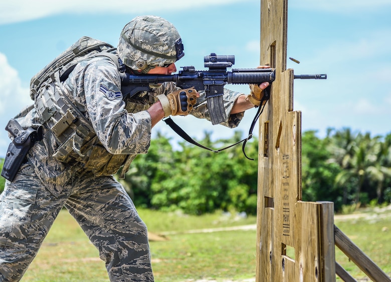 A U.S Airman fires a M4 carbine rifle during the second annual Security Forces Advanced Combat Skills Assessment June 7, 2017, at Andersen Air Force Base, Guam. Over 100 Airmen and Soldiers throughout U.S. Pacific Command’s area of responsibility gathered to compete in five different categories: weapons, tactics, combat fitness, mental and physical challenge, and military working dog handling. (U.S. Air Force photo by Airman 1st Class Christopher Quail)