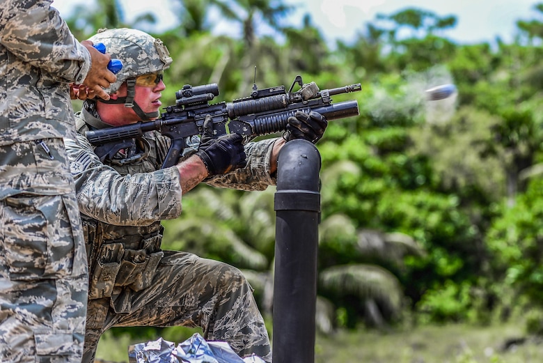U.S Air Force Staff Sgt. Willard Marshall, 354th Security Forces Squadron, Eielson Air Force Base, Alaska, fires an M203 grenade launcher during the second annual Security Forces Advanced Combat Skills Assessment June 7, 2017, at Andersen Air Force Base, Guam. Over 100 Airmen and Soldiers throughout U.S. Pacific Command’s area of responsibility gathered to compete in the weeklong challenge. Service members were assessed in five different categories: weapons, tactics, combat fitness, mental and physical challenge, and military working dog handling. (U.S. Air Force photo by Airman 1st Class Christopher Quail)
