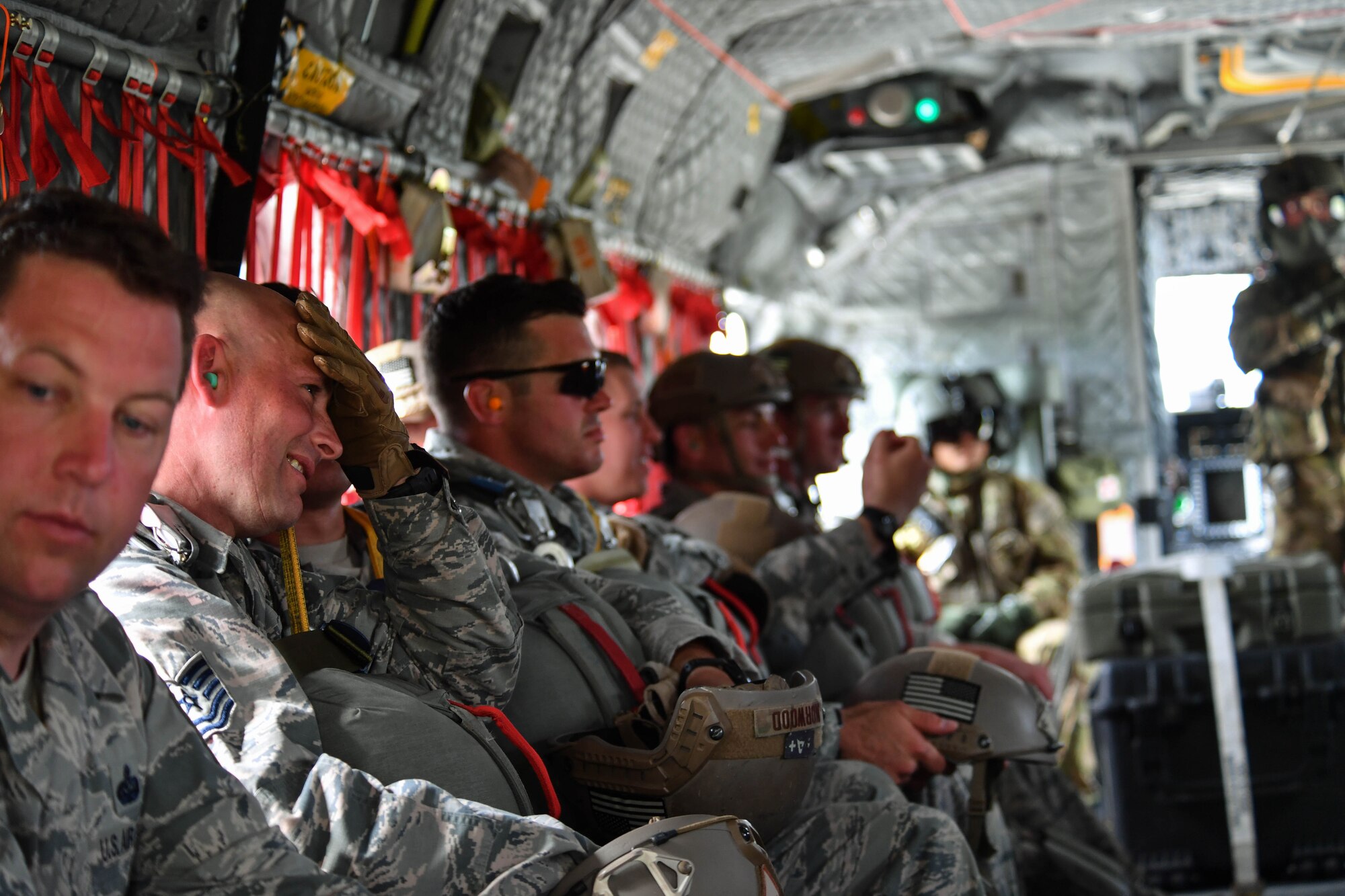 U.S. Air Force Airmen assigned to the 435th Contingency Response Group sit inside a U.S. Army CH-47 Chinook during exercise Saber Strike 17 at Lielvarde Air Base, Latvia, June 10, 2017. The 435th CRG Airmen parachuted out of the Chinook to prepare them for such operations when deployed. Saber Strike 17 highlights the inherent flexibility of ground and air forces to rapidly respond to crises allowing for the right presence where it is needed, when it is needed. (U.S Air Force photo by Senior Airman Tryphena Mayhugh)