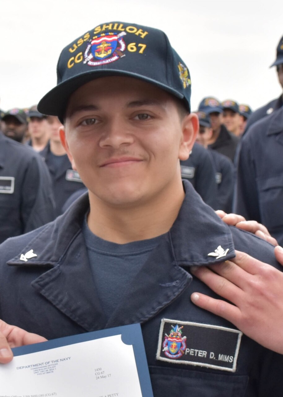 PACIFIC OCEAN (May 25, 2017) Gas Turbine Systems Technician (Mechanical) 3rd Class Peter Mims poses for a photo after being frocked to the rank of petty officer third class during a ceremony aboard the forward-deployed Ticonderoga-class guided-missile cruiser USS Shiloh (CG 67). Shiloh is on patrol in the U.S. 7th Fleet area of operations in support of security and stability in the Indo-Asia- Pacific region.  (U.S. Navy photo by Mass Communication Specialist Seaman Pat Morrissey/Released)