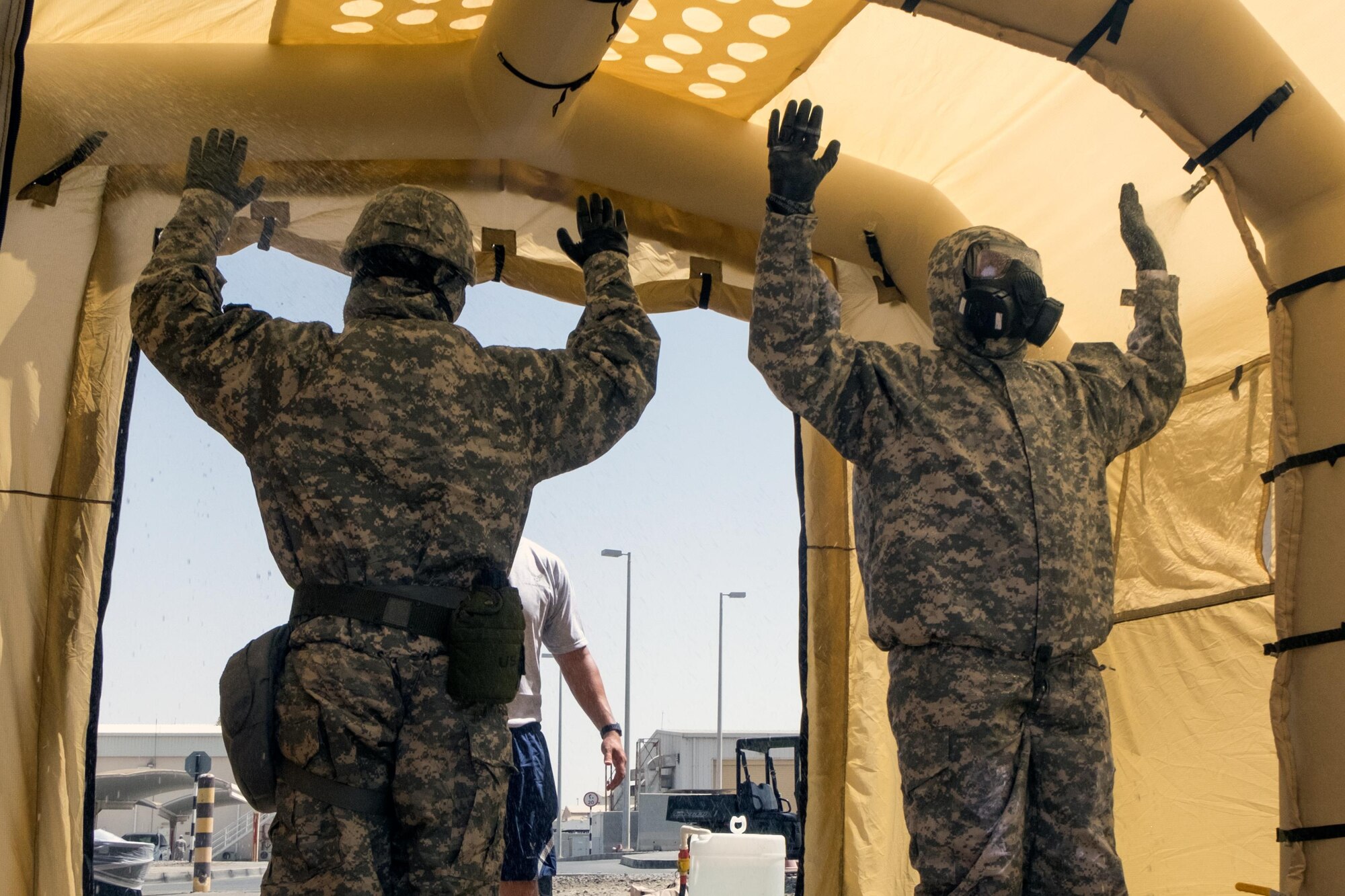 Soldiers with the 3rd Battalion, 4th Air Defense Artillery, undergo Contamination Control Area training in a Lightweight Inflatable Decontamination System June 8, 2017, at an undisclosed location in southwest Asia. Personnel are taken to a CCA to be decontaminated in a safe environment. (U.S. Air Force photo by Senior Airman Preston Webb)