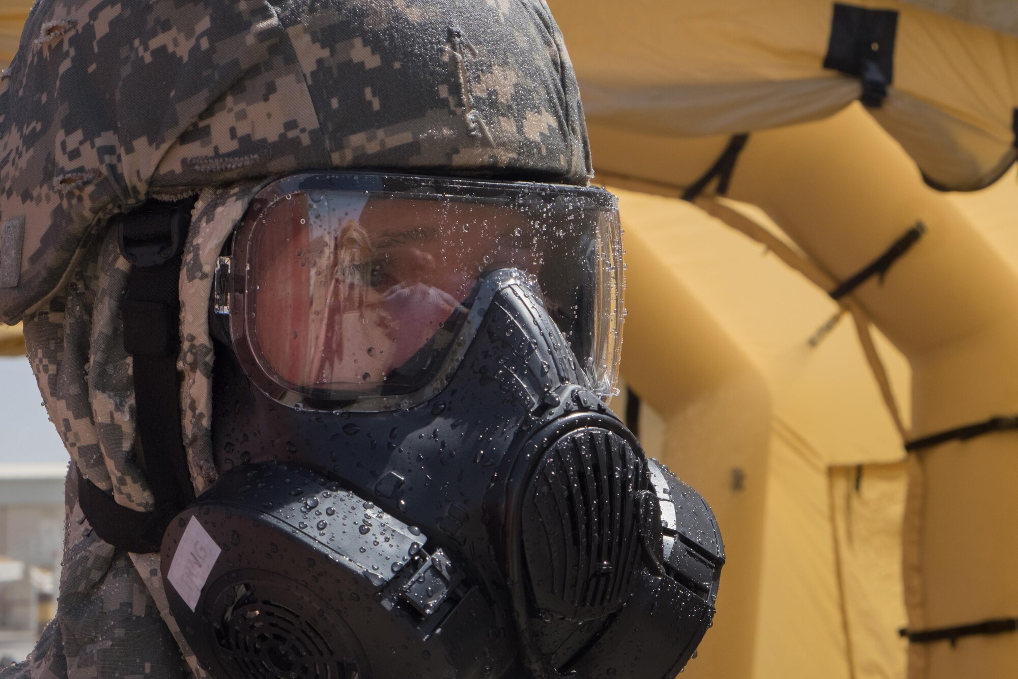 A Soldier with the 3rd Battalion, 4th Air Defense Artillery, undergoes Contamination Control Area training in a Lightweight Inflatable Decontamination System June 8, 2017, at an undisclosed location in southwest Asia. This training familiarized Airmen and Soldiers with CCA procedures during wartime operations. (U.S. Air Force photo by Senior Airman Preston Webb)