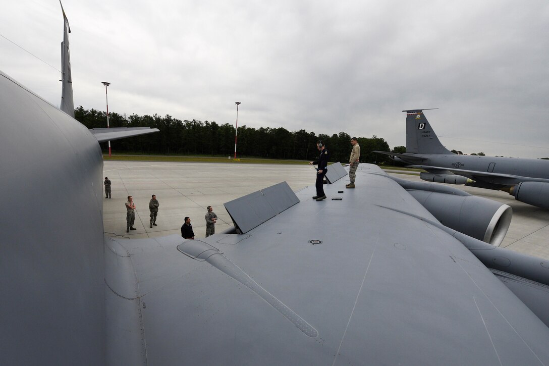 Airmen inspect a KC-135R Stratotanker aircraft during Baltic Operations 2017 at Powidz Air Base, Poland, June 6, 2017. Air Force photo by Staff Sgt. Jonathan Snyder