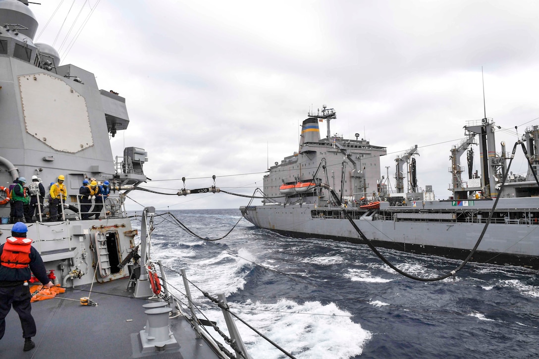Sailors aboard the Arleigh Burke-class guided-missile destroyer USS Wayne E. Meyer, left, receive cargo and fuel from the Lewis and Clark-class dry cargo ship USNS Charles Drew during a replenishment-at-sea in the western Pacific Ocean, June 7, 2017. Navy photo by Petty Officer 3rd Class Kelsey L. Adams