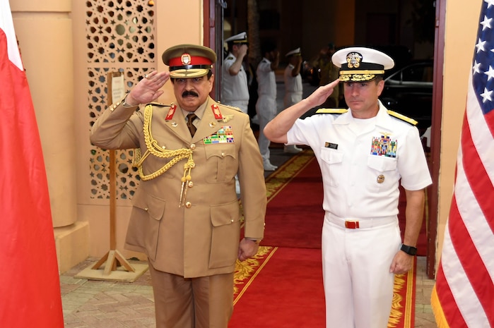 His Majesty, King Hamad bin Isa Al Khalifa, the King of the Kingdom of Bahrain, and Vice Adm. Kevin M. Donegan, commander of U.S. 5th Fleet salute during the Kingdom of Bahrain’s national anthem after arriving to discuss operations in the U.S. 5th Fleet area of operations and coalition operations to defeat ISIS, June 12. The King was accompanied by two of his sons, His Highness Brig. Gen. Shaikh Nasser bin Hamad Al Khalifa, Commander of the Royal Guard, and His Highness Maj. Shaikh Khaled bin Hamad Al Khalifa, Commander of the Royal Guard Special Force; the Commander-in-Chief of the Bahrain Defense Force, His Excellency Field Marshal Shaikh Khalifa bin Ahmed Al Khalifa; and the Commander of the Bahraini Royal Navy, His Excellency Rear Adm. Shaikh Khalifa bin Abdullah Al Khalifa. Bahrain has been a partner with the United States in regional maritime security for nearly 70 years. 