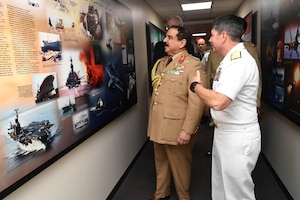 His Majesty, King Hamad bin Isa Al Khalifa, the King of the Kingdom of Bahrain and Vice Adm. Kevin M. Donegan Commander, U.S. 5th Fleet talk about a poster of naval history in the region during a visit to discuss operations in the U.S. 5th Fleet area of operations and coalition operations to defeat ISIS, June 12. The King was accompanied by two of his sons, His Highness Brig. Gen. Shaikh Nasser bin Hamad Al Khalifa, Commander of the Royal Guard, and His Highness Maj. Shaikh Khaled bin Hamad Al Khalifa, Commander of the Royal Guard Special Force; the Commander-in-Chief of the Bahrain Defense Force, His Excellency Field Marshal Shaikh Khalifa bin Ahmed Al Khalifa; and the Commander of the Bahraini Royal Navy, His Excellency Rear Adm. Shaikh Khalifa bin Abdullah Al Khalifa. Bahrain has been a partner with the United States in regional maritime security for nearly 70 years. 