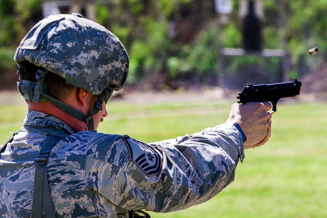 Air Force Master Sgt. Nathan McCloud, a member of the New York Air National Guard, fires an M9 pistol during competition at Camp Smith Training Site, N.Y., June 3, 2017. McCloud is a crew chief assigned to the 174 Attack Wing. The guardsmen competed during the Lt. Col. William Donovan Team Pistol Match at the 38th annual Adjutant General's Combat Sustainment Training Exercise Match. The competition promotes excellence in marksmanship and weapon systems skills in a battle-focused environment. Army National Guard photo by Spc. Jonathan Pietrantoni