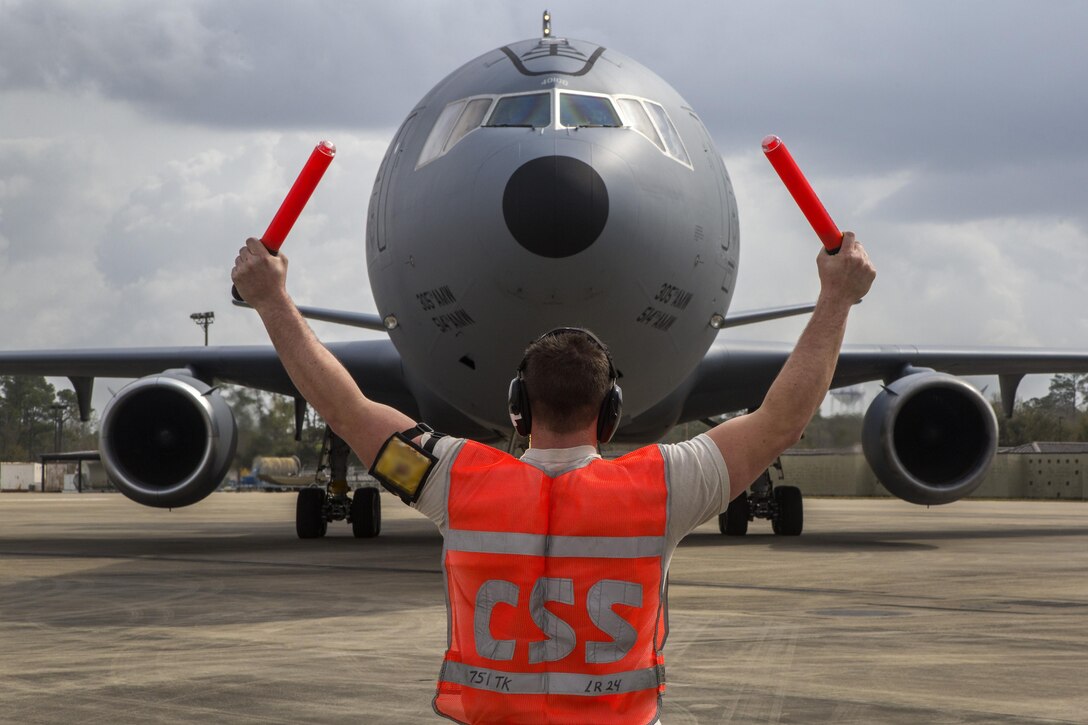 Airman 1st Class Jacob Coles, 605th Aircraft Maintenance Squadron, Air Mobility Command, marshals a KC-10 Extender with the 305th Air Mobility Wing at the Combat Readiness Training Center at Gulfport, Miss., in support of Crisis Response '17 March 5, 2017. Close to 700 Air Mobility Command Airmen with the 514th Air Mobility Wing, the 305th Air Mobility Wing, the 87th Air Base Wing, and the 621st Contingency Response Wing are participating in the mobilization exercise. (U.S. Air Force photo by Master Sgt. Mark C. Olsen/Released)
