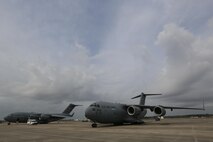 A KC-10 Extender, left, and a C-17 Globemaster III, both assigned to the 305th Air Mobility Wing is parked on the flight line at the Combat Readiness Training Center at Gulfport, Miss., in support of Crisis Response '17 March 5, 2017. Close to 700 Airmen with the 514th Air Mobility Wing, the 305th Air Mobility Wing, the 87th Air Base Wing, and the 621st Contingency Response Wing are participating in the mobilization exercise Crisis Response '17. (U.S. Air Force photo by Master Sgt. Mark C. Olsen/Released)