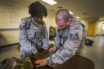 Staff Sgts. Ama Sey, left, and Thomas Reilly, both with the 514th Security Forces Squadron, Air Mobility Command, label their Mission-Oriented Protective Posture gear at the Combat Readiness Training Center at Gulfport, Miss., in support of Crisis Response '17 March 5, 2017. Close to 700 Air Mobility Command Airmen with the 514th Air Mobility Wing, the 305th Air Mobility Wing, the 87th Air Base Wing, and the 621st Contingency Response Wing are participating in the mobilization exercise. (U.S. Air Force photo by Master Sgt. Mark C. Olsen/Released)