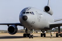 A crew chief maintains contact with the flight crew of a 305th Air Mobility Wing KC-10 Extender at the Combat Readiness Training Center at Gulfport, Miss., in support of Crisis Response '17 March 6, 2017 Close to 700 Air Mobility Command Airmen with the 514th Air Mobility Wing, the 305th Air Mobility Wing, the 87th Air Base Wing, and the 621st Contingency Response Wing are participating in the mobilization exercise. (U.S. Air Force photo by Master Sgt. Mark C. Olsen/Released)