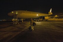 A KC-10 Extender aircrew with 76th Air Refueling Squadron, 514th Air Mobility Wing, prepares to leave for an early morning F-22 Raptor refueling mission over the Florida coast March 7, 2017. The 514th, which is located at Joint Base McGuire-Dix-Lakehurst, N.J., is participating in the mobilization exercise Crisis Response '17 at the Combat Readiness Training Center at Gulfport, Miss. (U.S. Air Force photo by Master Sgt. Mark C. Olsen/Released)