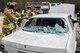 Staff Sgt. Manuel Santana, a firefighter with the 514th Civil Engineer Squadron, uses a halligan tool to break a vehicle window during a basic vehicle extrication training exercise at the Combat Readiness Training Center at Gulfport, Mississippi, in support of Crisis Response 2017 March 7, 2017. Close to 700 AMC Airmen from the 514th Air Mobility Wing, 305th Air Mobility Wing, 87th Air Base Wing, and the 621st Contingency Response Wing at Joint Base McGuire-Dix-Lakehurst, N.J., are participating in the mobilization exercise Crisis Response 2017. The primary goal of this exercise is for the four wings to deploy to an austere location and set up and sustain combat air mobility operations. (U.S. Air Force photo by Master Sgt. Mark C. Olsen/Released)