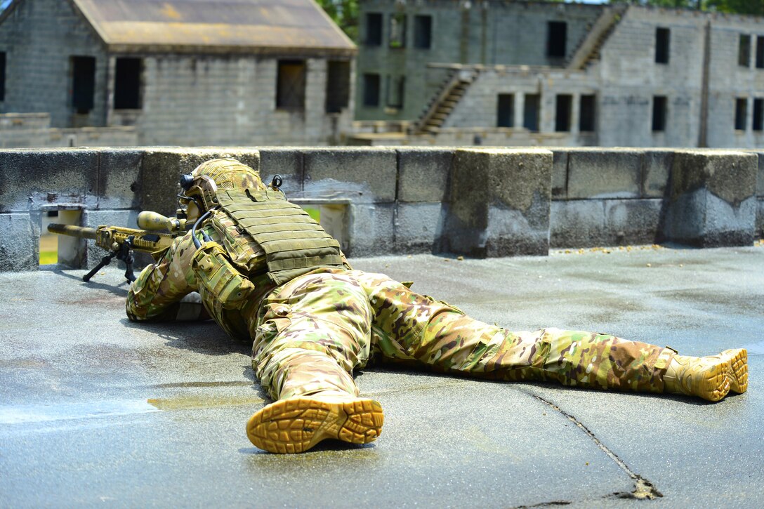 An Army Ranger sniper sets up a shot during an exercise hosted by U.S. Army Special Operations Command, Fort Bragg, N.C., June 6, 2017. Special Operations Command photo by Michael Bottoms
