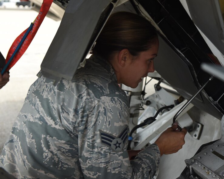 Senior Airman Sharon Maynard, a 44th Fighter Group aircraft armament systems specialist, performs maintenance on the chaff and flare countermeasure system on the F-22 Raptor at Tyndall Air Force Base, Fla. June 2, 2017. From testing and evaluating new weapons systems to loading ordnance, aircraft armament systems specialists ensure that when a pilot pulls the trigger devices successfully launch away from the aircraft toward the target. U.S. Air Force Col. Michael Hernandez, 325th Fighter Wing commander, spent time with Maynard as part of the Airman Shadow program. (U.S. Air Force photo by Senior Airman Cody R. Miller/Released)
